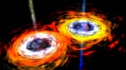 Dwie olbrzymie czarne dziury zderzą się za 21 lat. Wzbudzą fale grawitacyjne, które rozkołyszą Wszechświat